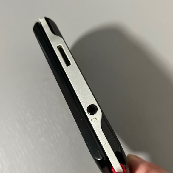 Sony Handheld Console with Black and Red Highlights